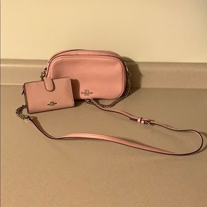 Small coach crossbody with matching wallet.